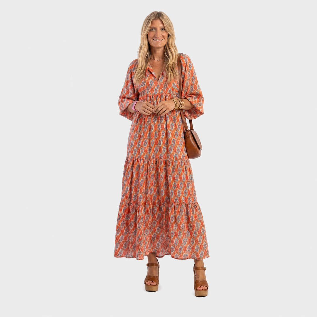 Urška – Oranžna geometrijska boho midi obleka